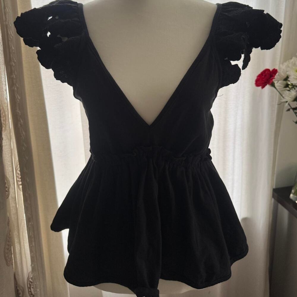 Anthropologie black babydoll top with floral embroidered sleeves